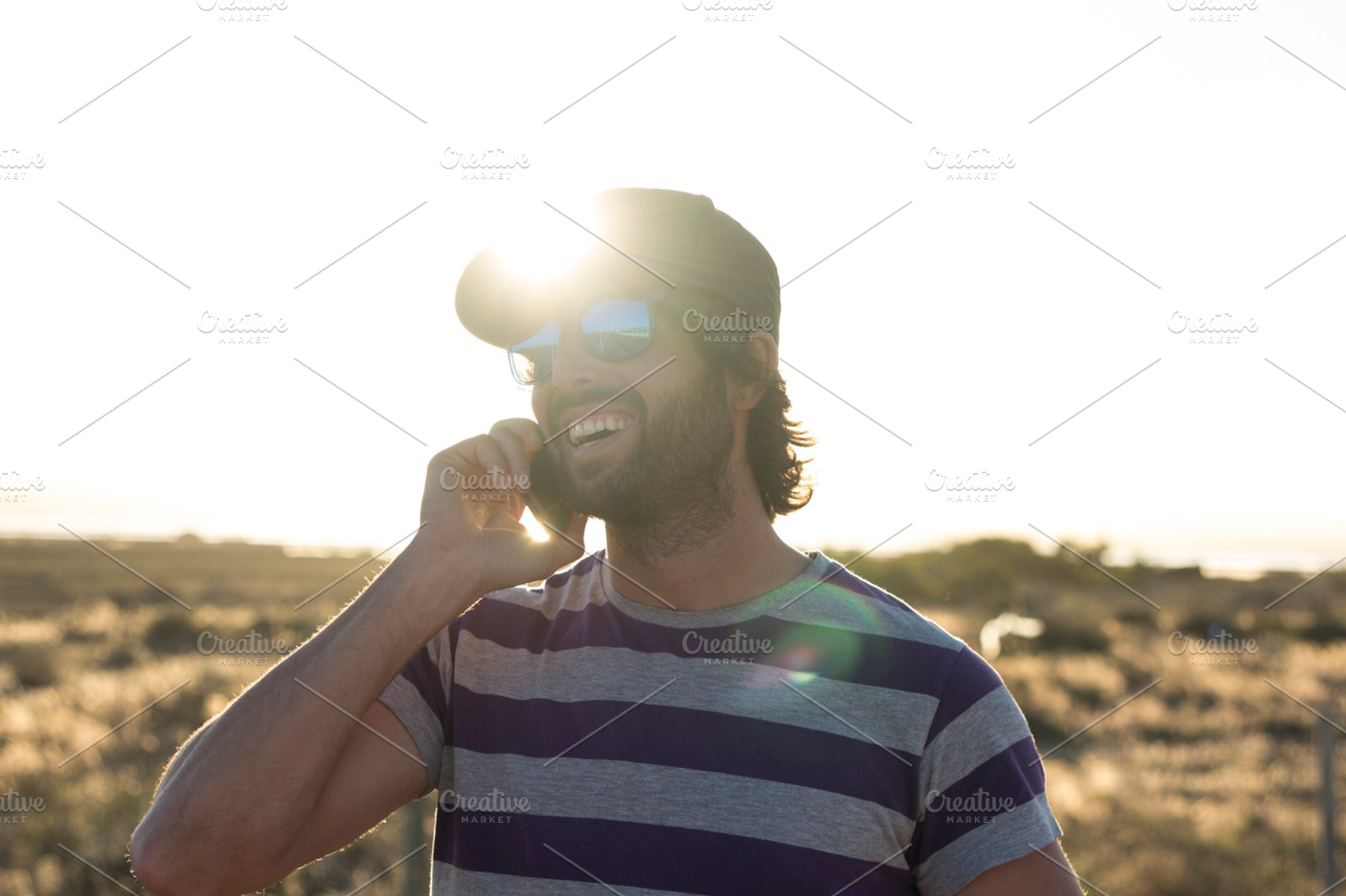 Handsome guy outdoor using phone containing adult, beard, and boy, a Person Photo by Carlos Die Banyuls