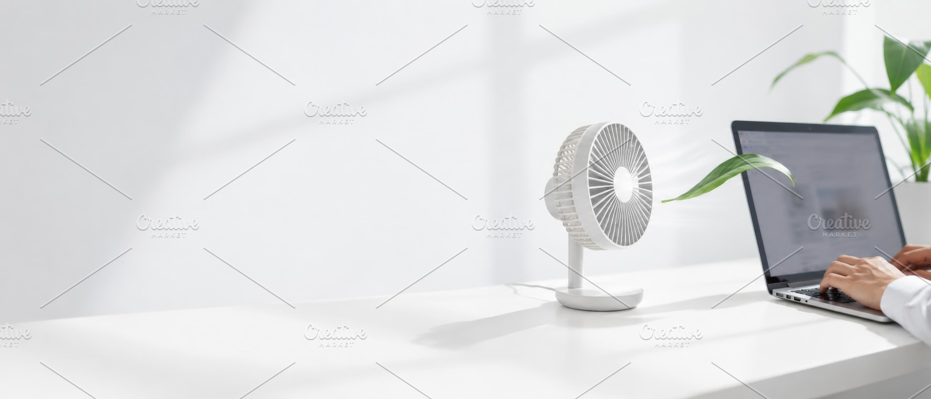 Cooling desk fan and laptop on white, a Photo by Dvoevnore photos