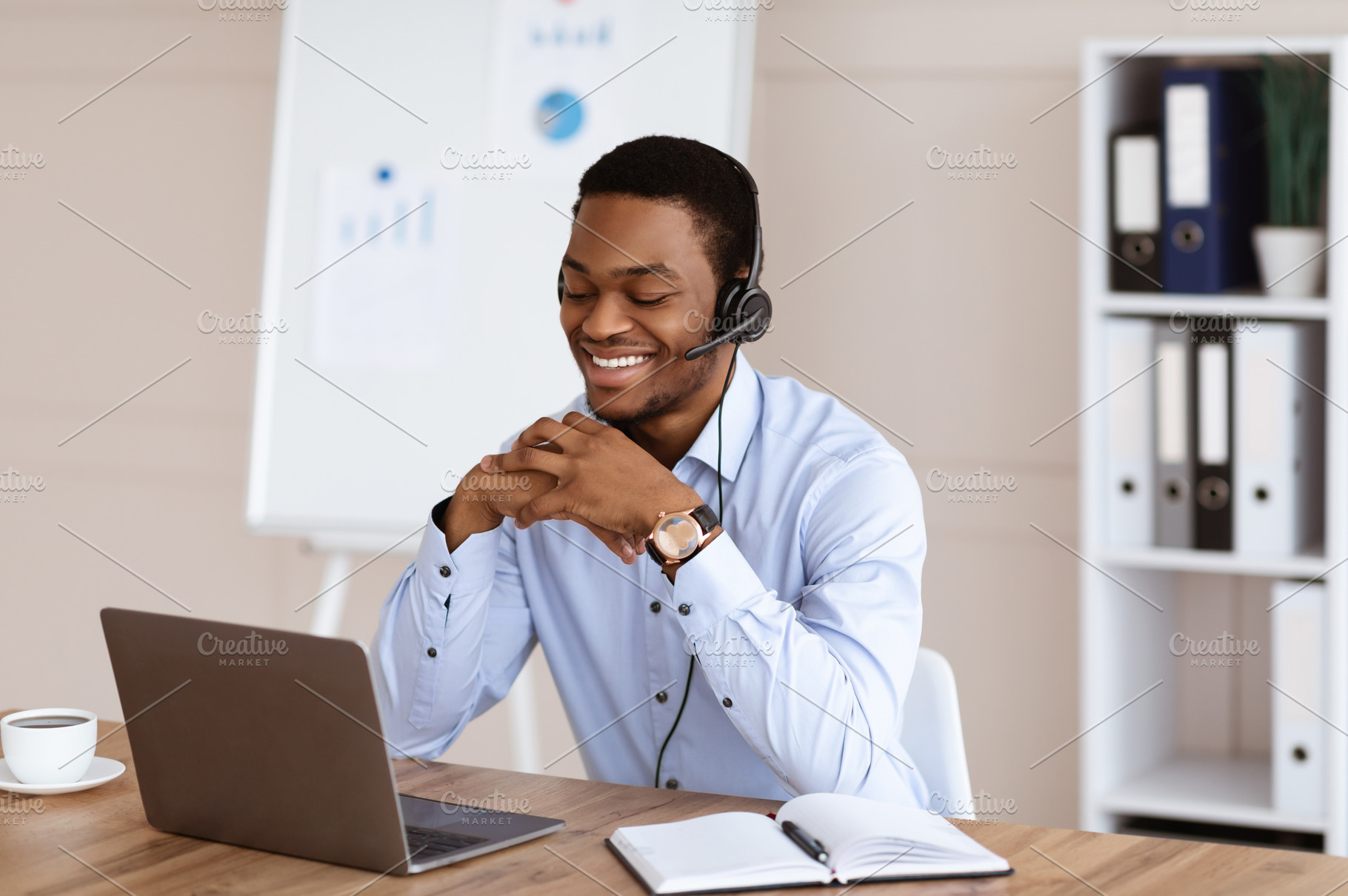 Happy black man having online training, office interior, a Photo by Prostock-Studio