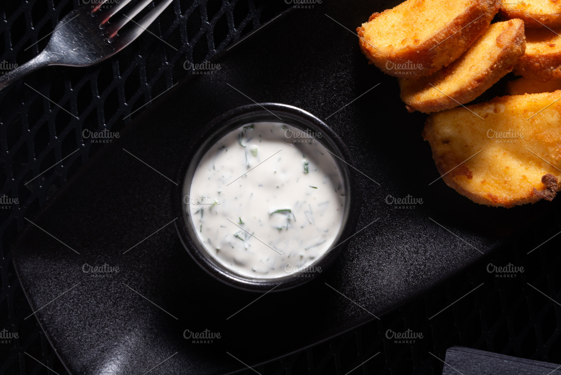 Mayonnaise Sauce with Herbs in Small Bowl on Black Tray, Top Vie, a Photo by MDBildes