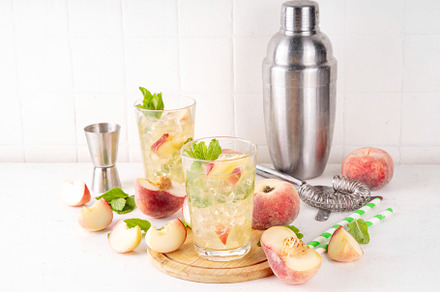 Flat chinese peach and lime lemonade, mojito cocktail
