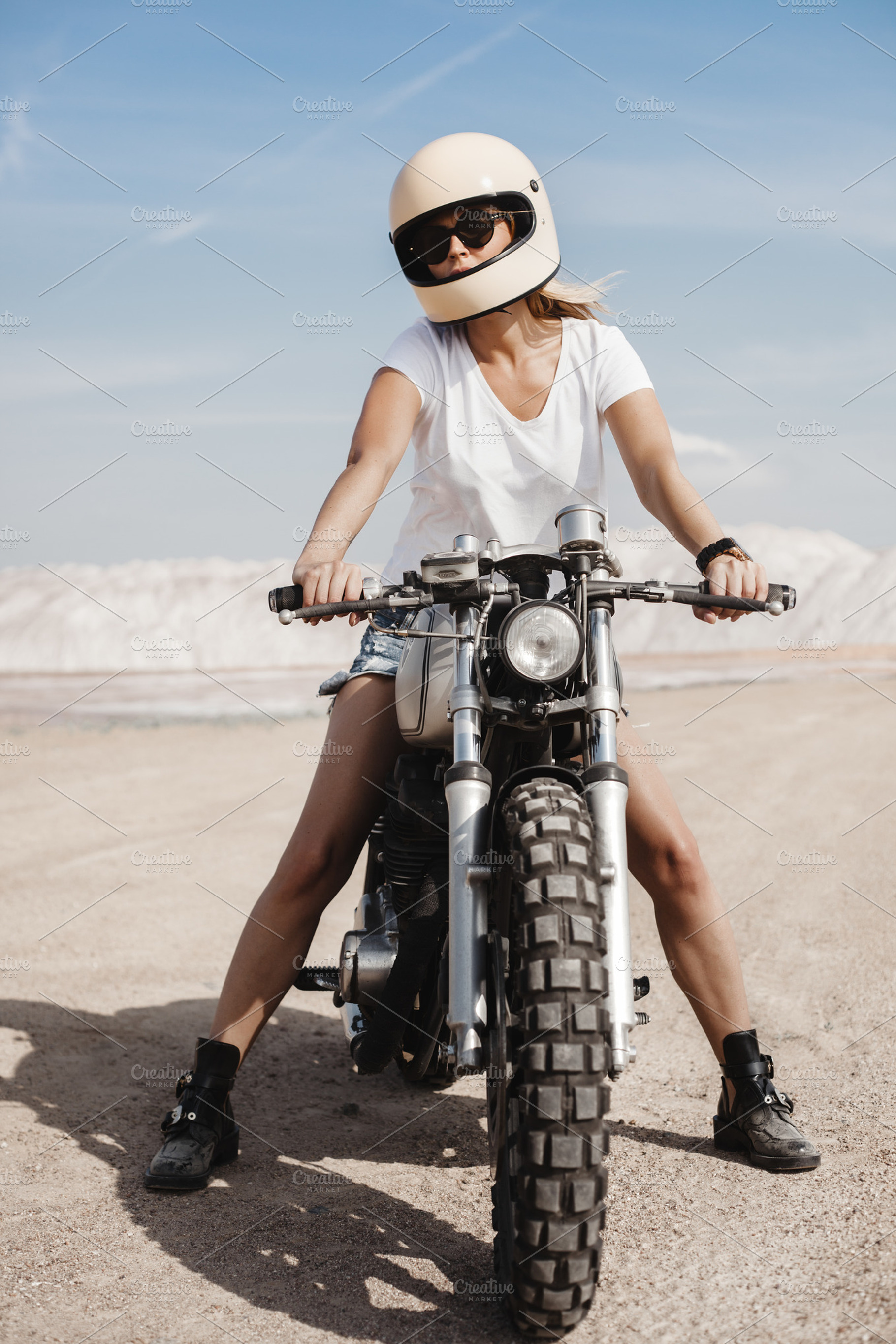 Female on custom built cafe racer motorcycle containing background, woman, a Transportation Photo by Aliaksei Kaponia