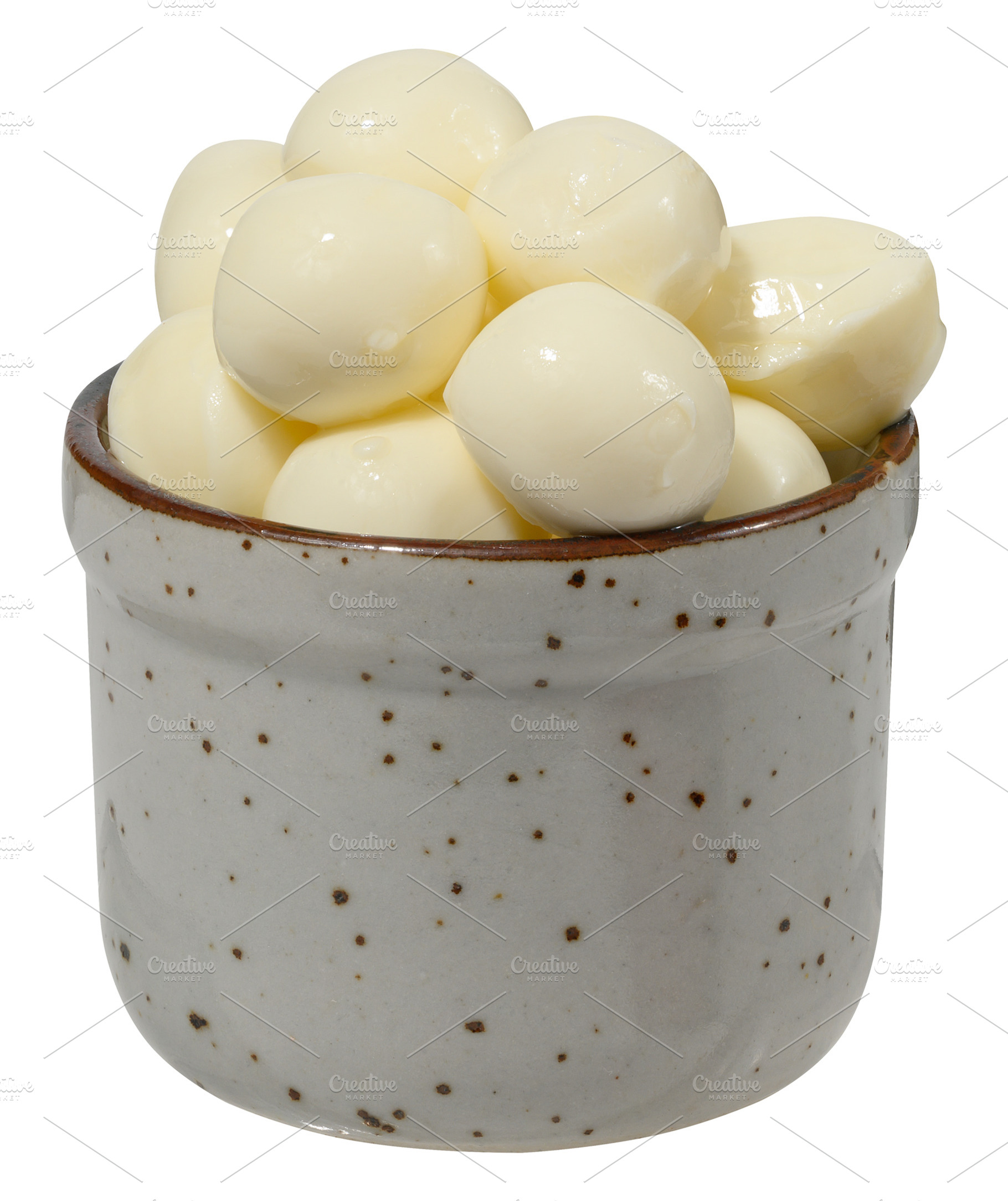 Round pieces of mozzarella in ceramic bowl, a Food & Drink Photo by ndanko