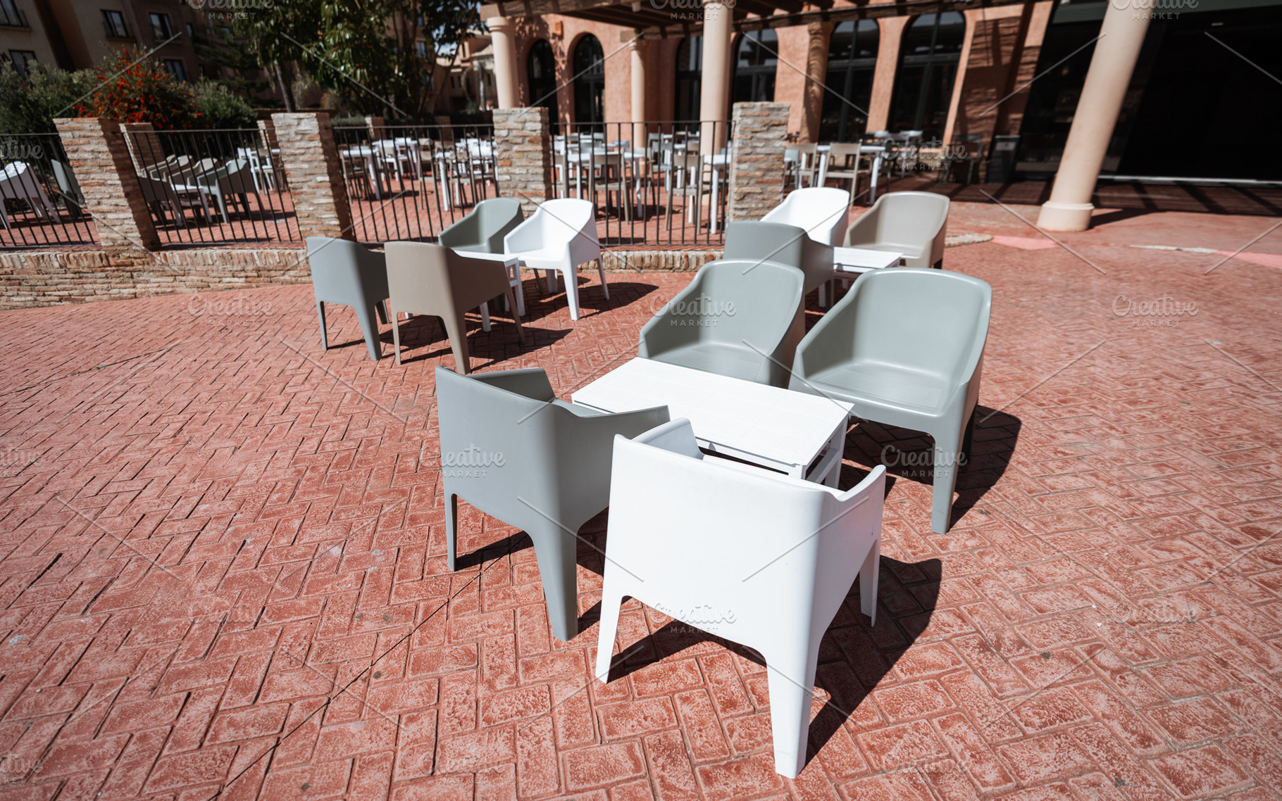 Modern empty outdoor patio seating, a Food & Drink Photo by SkyNext