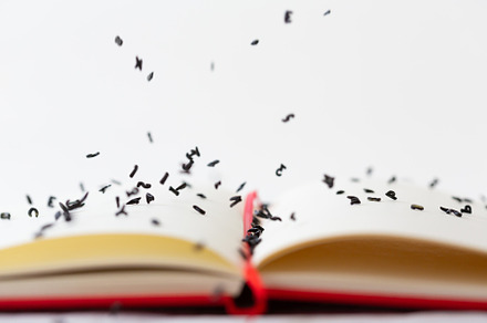 Empty text book featuring book, letters, and falling