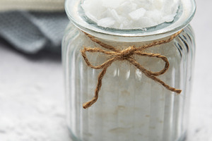 Magnesium flakes in glass jar for a relaxing bath with towels, a Beauty & Fashion Photo by Olena Rudo