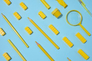Various yellow objects including pencils, magnifying glass and t, an Abstract Photo by ndanko