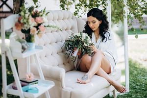 black-haired bride prepares for her wedding in a boudoir, a Person Photo by Weddings, People, Travel