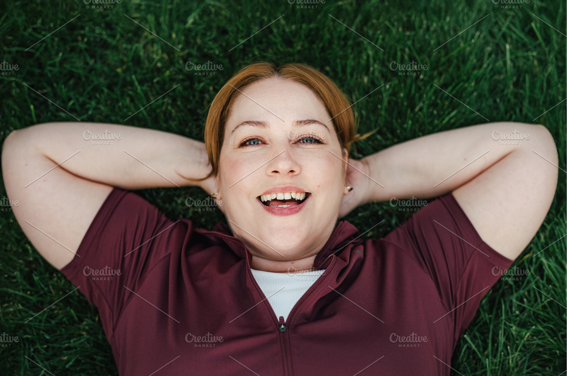 Beautiful plus size woman lying on, a Sports & Recreation Photo by HalfPoint