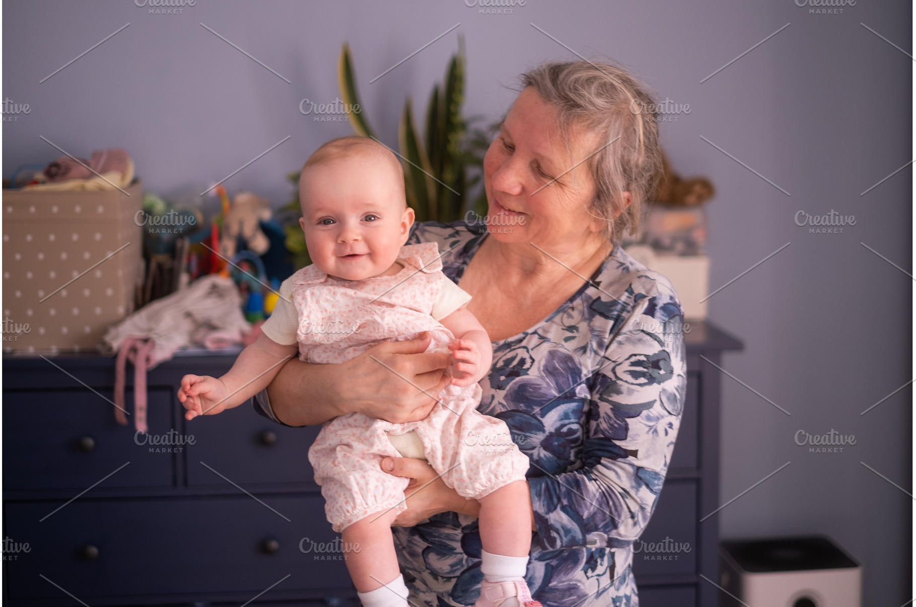 Elderly woman grandmother holding a, a Person Photo by Koldunova