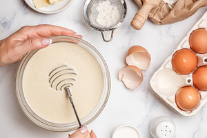 Woman prepares dough for homemade pa