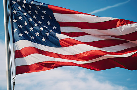 American flag waving proudly in the, a Photo by SaroStock
