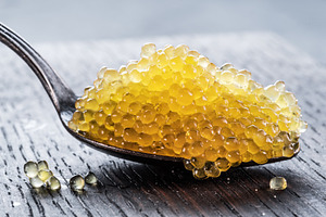 Pike caviar or roe in spoon on woode, a Food & Drink Photo by Volff