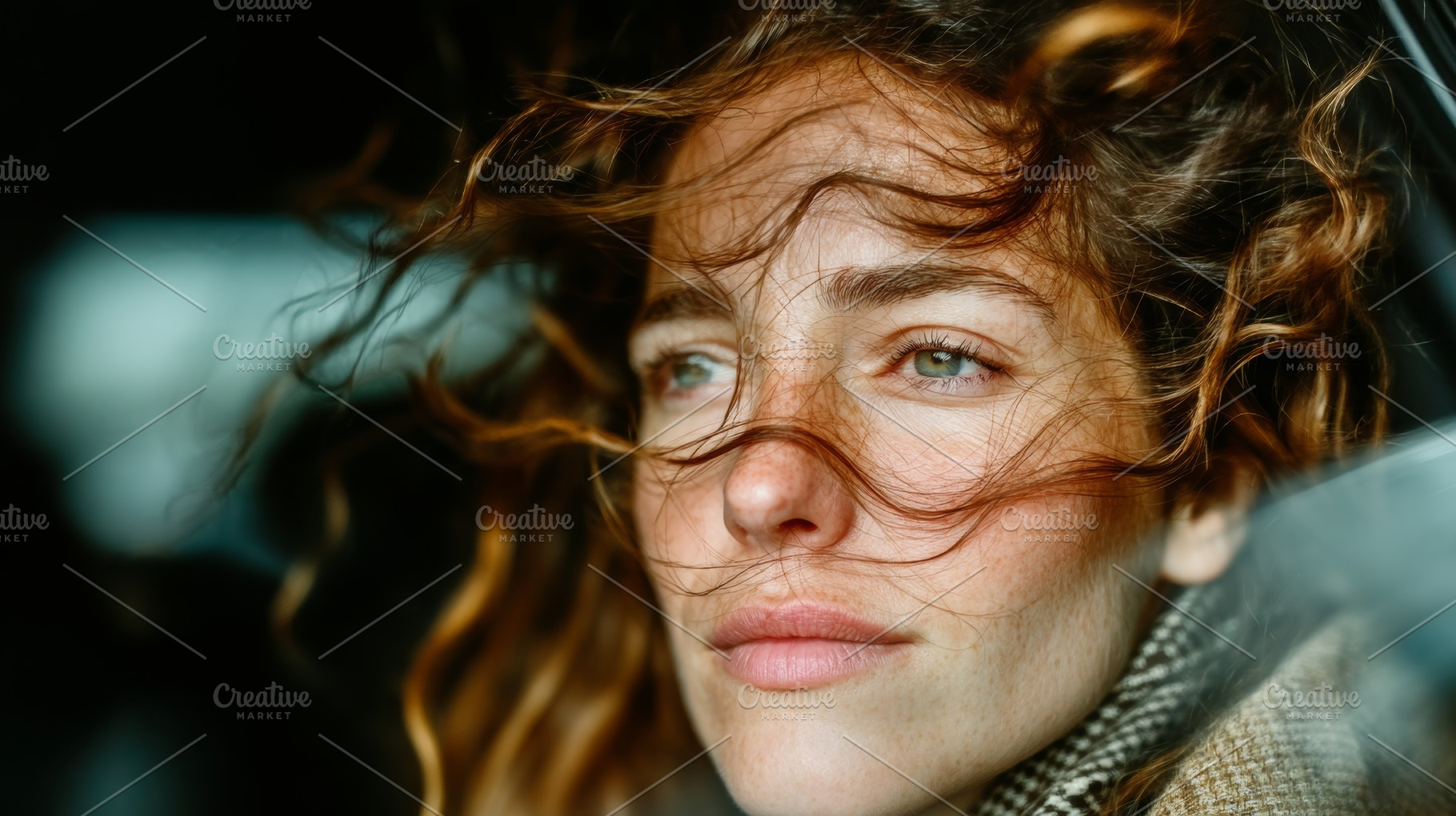 Close up of a woman with wind-swept hair looking thoughtful, a Photo by AS photostudio