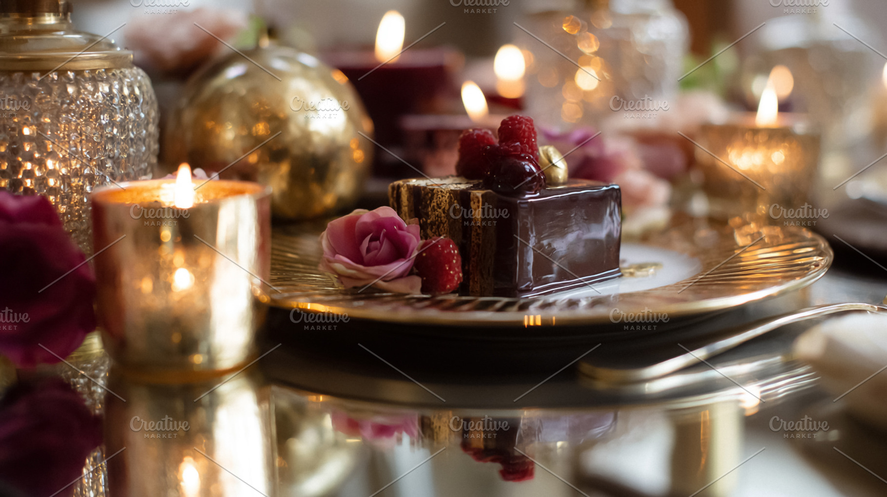Chocolate cake with fresh raspberries and a pink rose, served on, a Photo by Studio ANNA