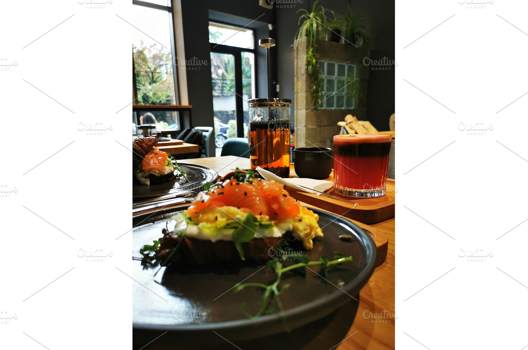 Croissant with salmon, cold coffee, a Food & Drink Photo by sceptical cactus