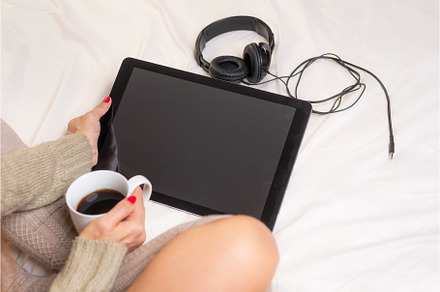 Woman in bed with a cup of coffee, a Person Photo by david.herraez.calzad