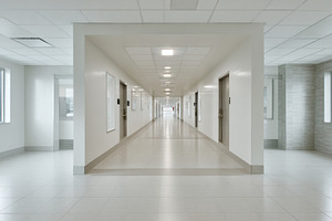 Long empty hallway in a building, a Photo by Beautiful things