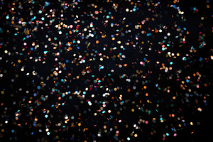 Colorful falling confetti on black background, a Background Photo by AlyaAnd