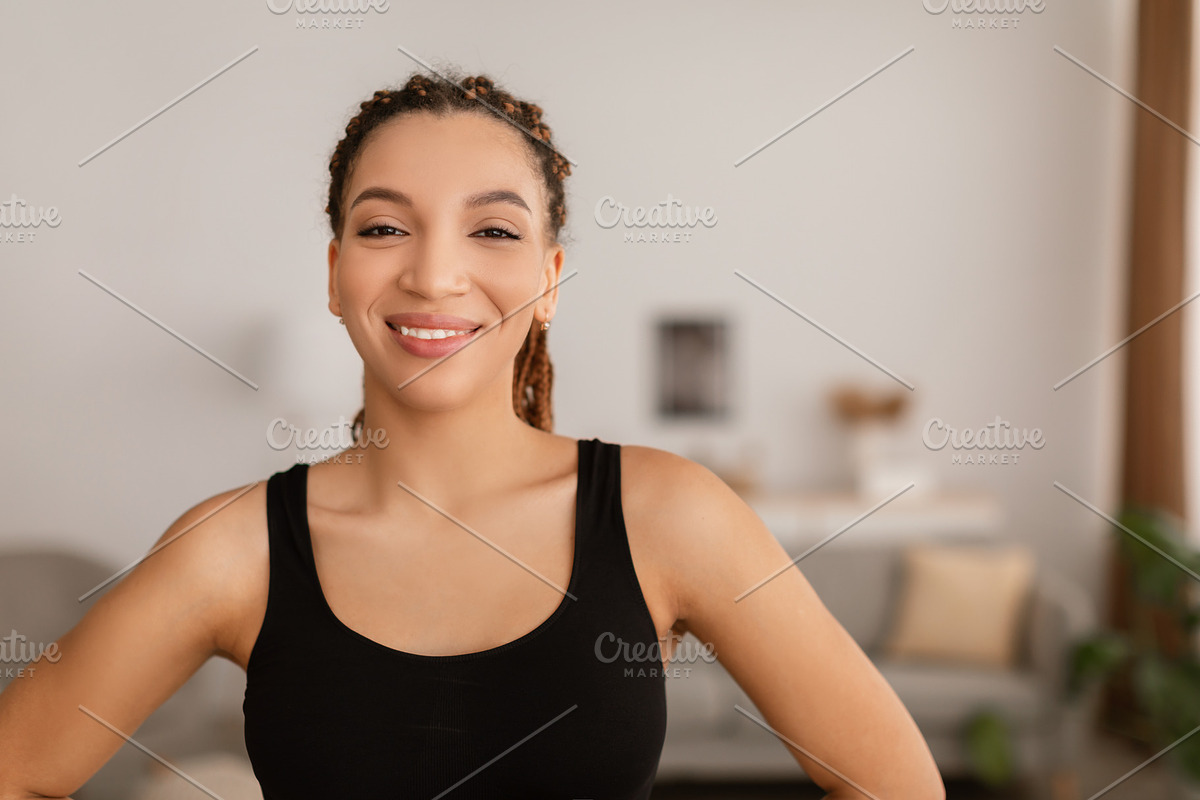 Cheerful Black Fitness Lady Posing Wearing Fitwear At Home, a Photo by Prostock-Studio (Photo 2 of 2)