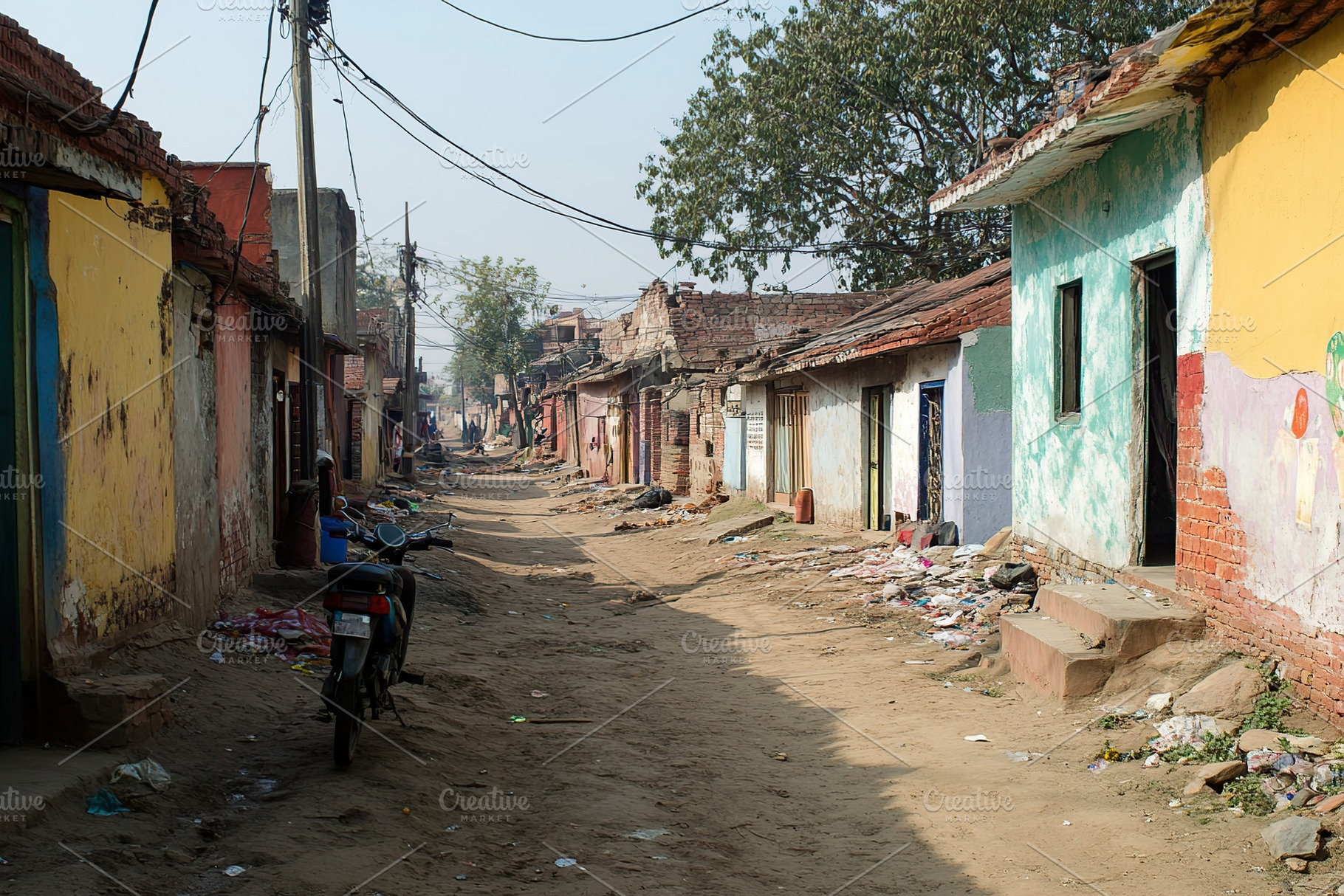 Vibrant Indian village street bustling with daily life in daytime, an Architecture Photo by AlyaAnd