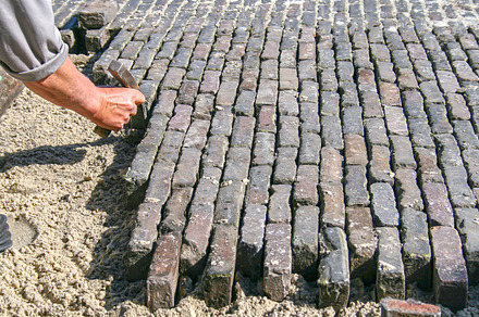 Paving a road is hard work