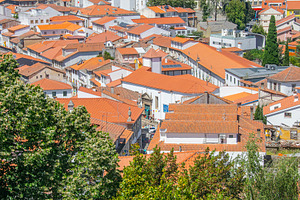 Aerial view of rooftops in braganca city, portugal, an Architecture Photo by DanFLCreativo