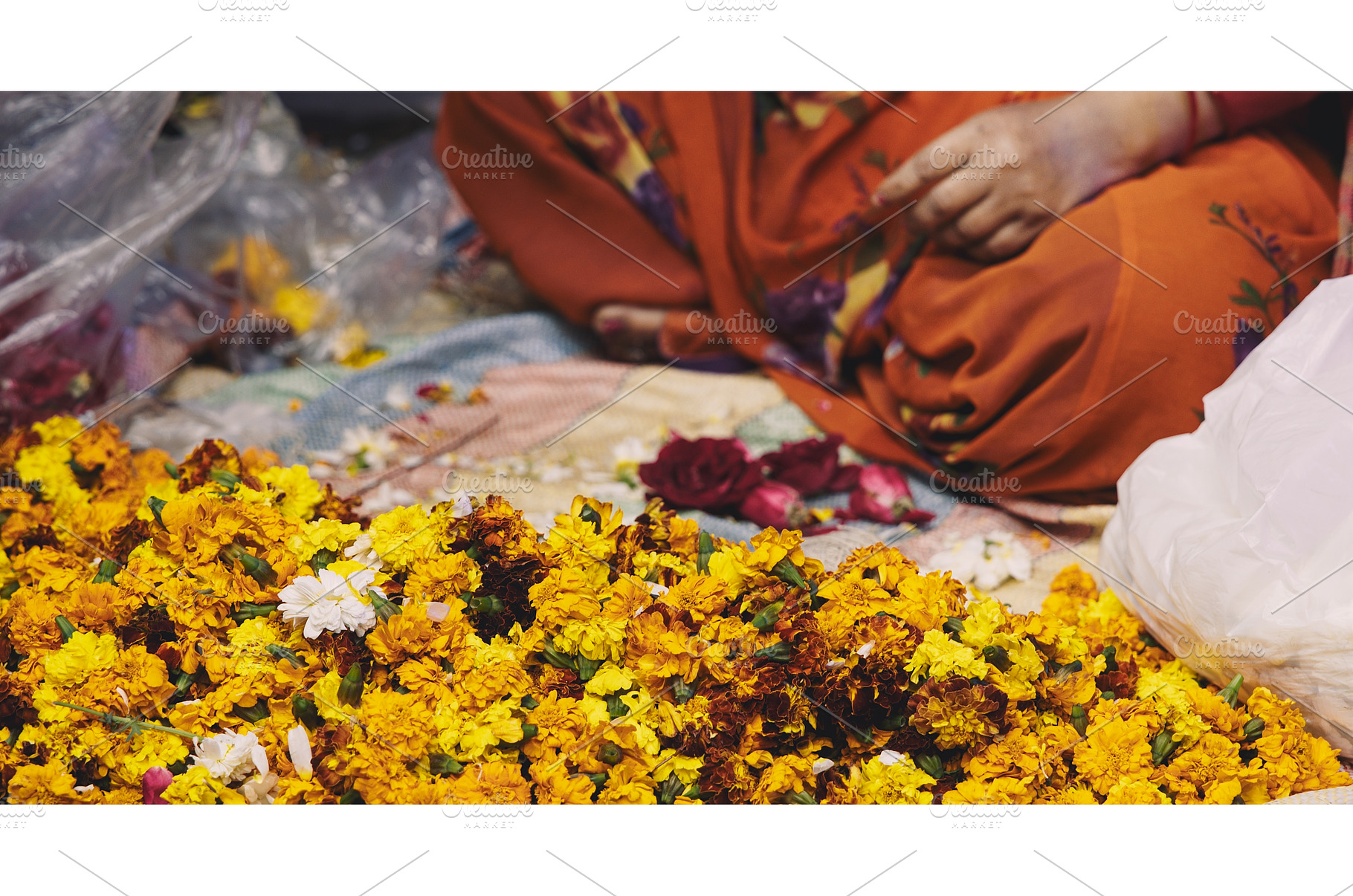Woman making flower garland at night, a Nature Photo by Our Amazing World