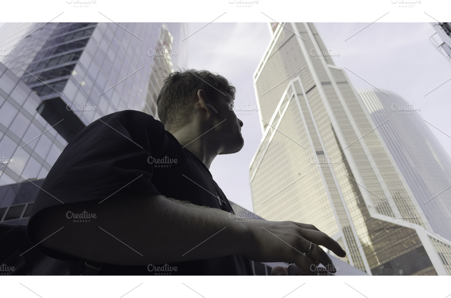 Young manager walking and talking on, an Architecture Photo by Media Whale Stock