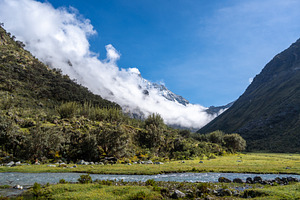 River and snow-capped mountains along the Laguna 69 trek in Huar, a Nature Photo by GoodGoods