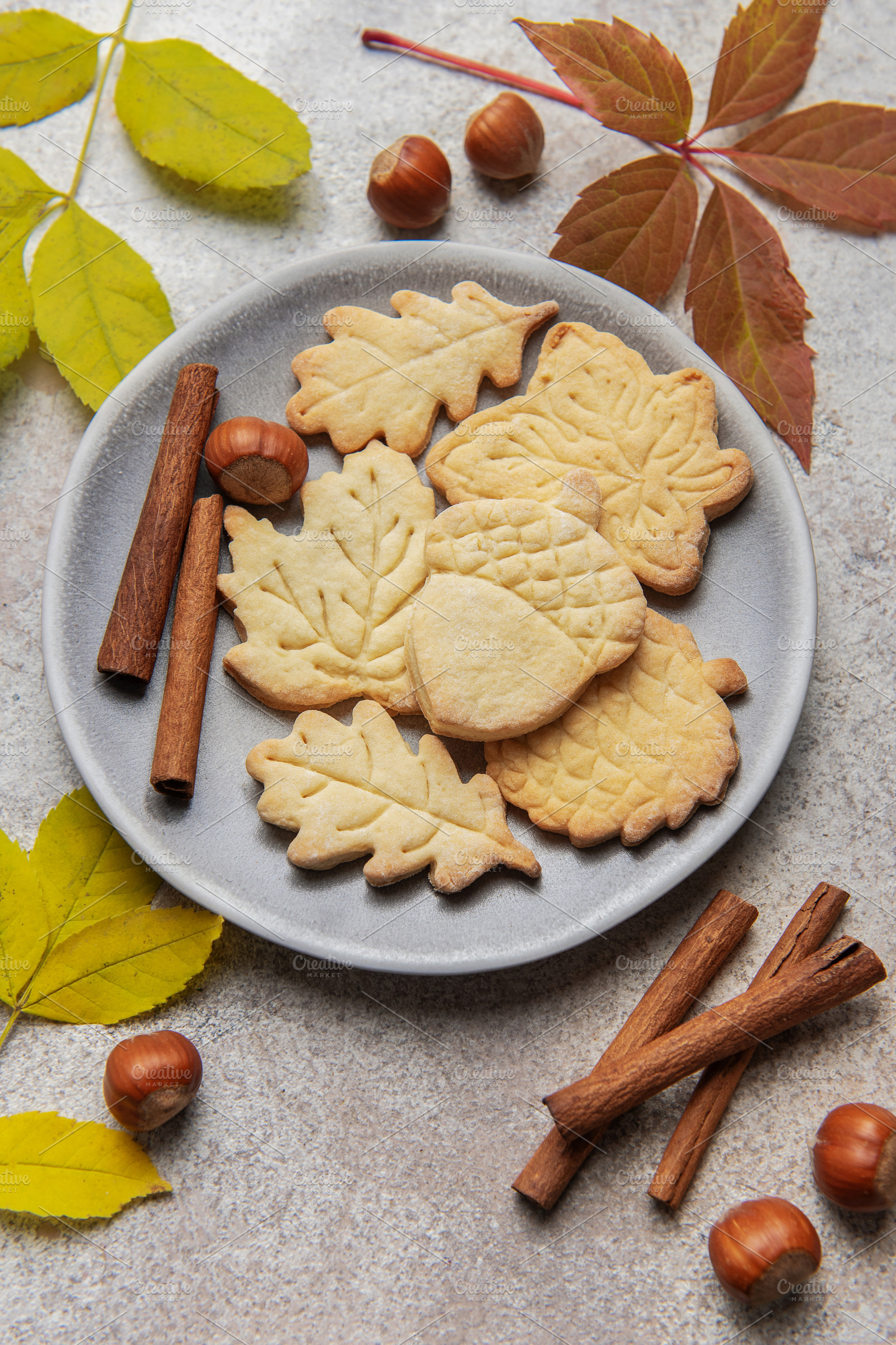 Autumn cookies on plate with cinnamon and hazelnuts, a Food & Drink Photo by Olena Rudo