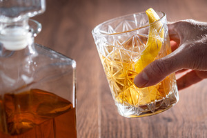 Hand picking up a Rusty Nail cocktail glass, a Food & Drink Photo by etorres69