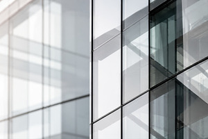 Sunlight reflects on glass facade, a Photo by Beautiful things