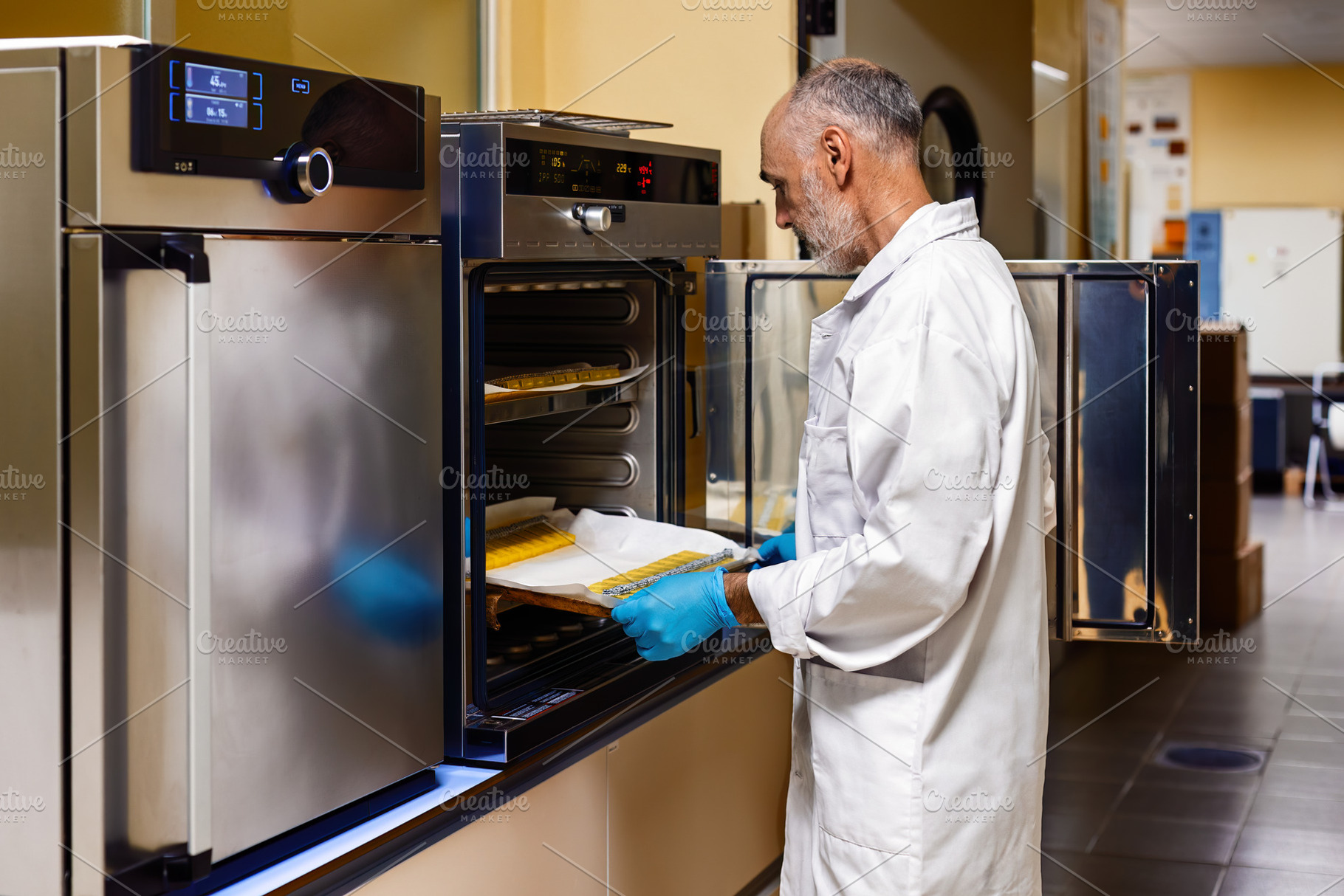 Scientist working with an incubator, a Health & Medical Photo by Perpis