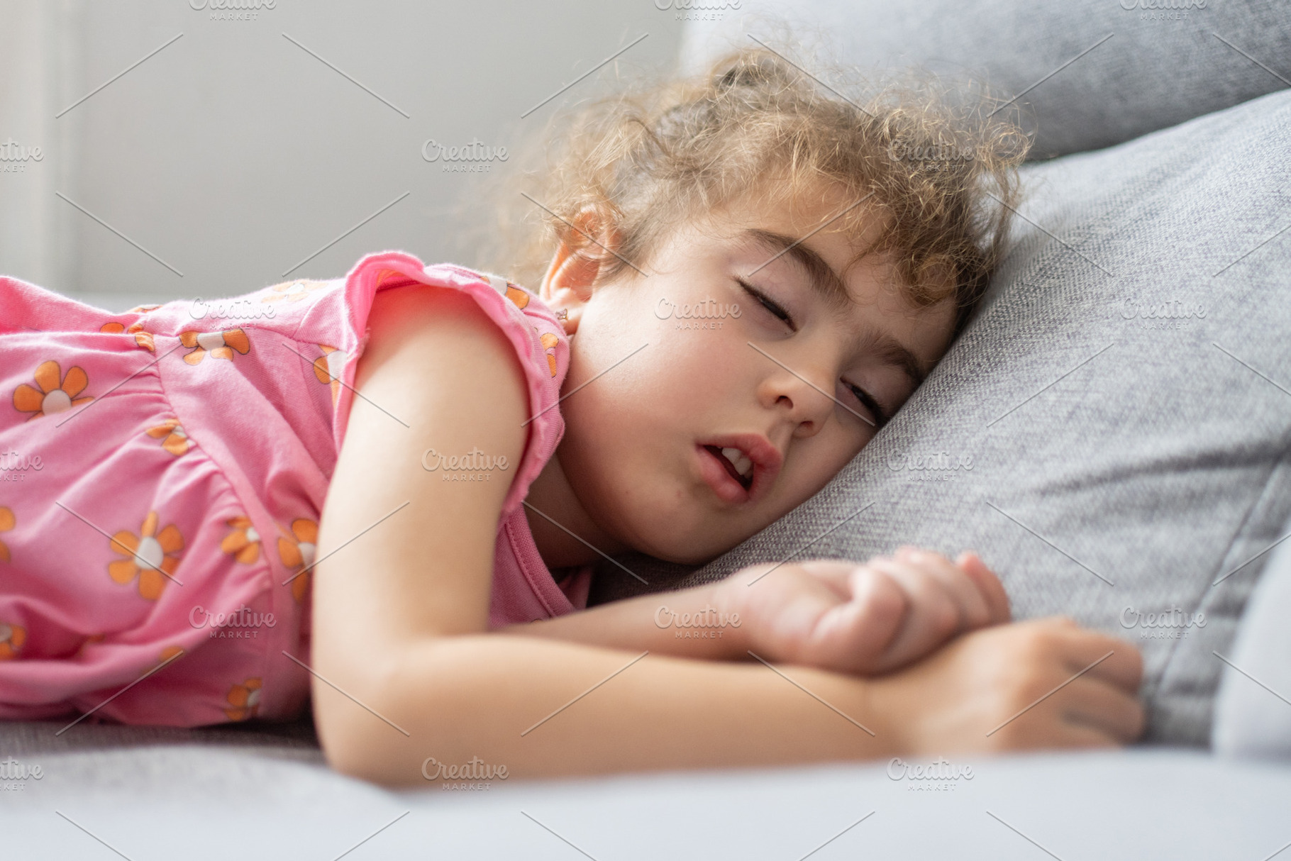 Sleeping little girl resting on sofa at home, a Person Photo by etorres69