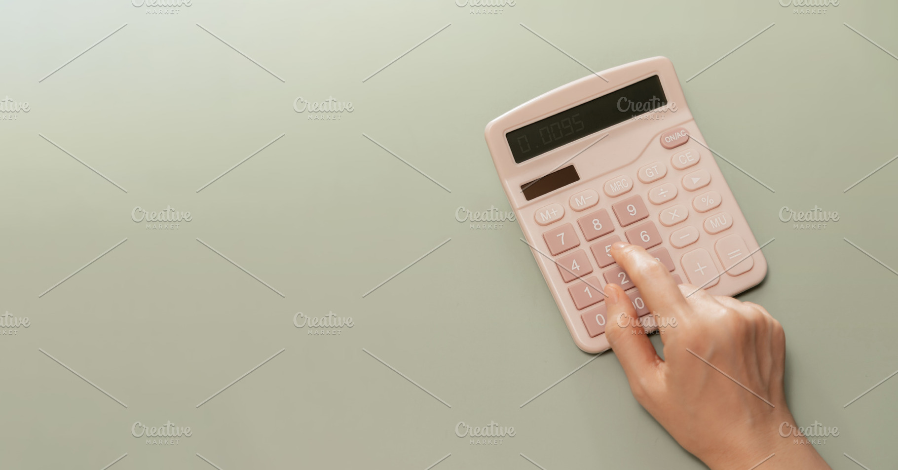 Hand using calculator on pastel background. Concept of personal, a Photo by salmon.black