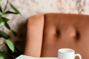 Coffee cup and notebook on round mar, a Photo by Dvoevnore photos