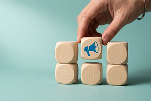 Wooden Block with Megaphone Icon, a Business Photo by thepslr