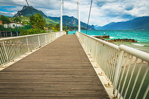 Walkway on the pedestrian bridge, an Architecture Photo by Alpine Dreams