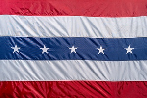 Close-up of a red, white, and blue patriotic flag with stars. US, a Background Photo by GoodGoods