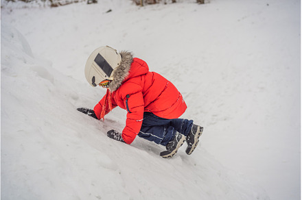 Cute boy climbs on a snowy mountain, a Nature Photo by Elizaveta Galitskaya
