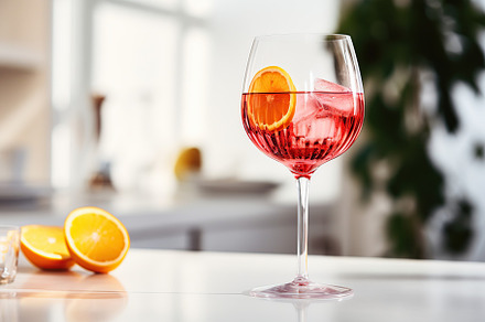 Alcohol cocktail in wineglass on kitchen table, a Food & Drink Photo by AlyaAnd
