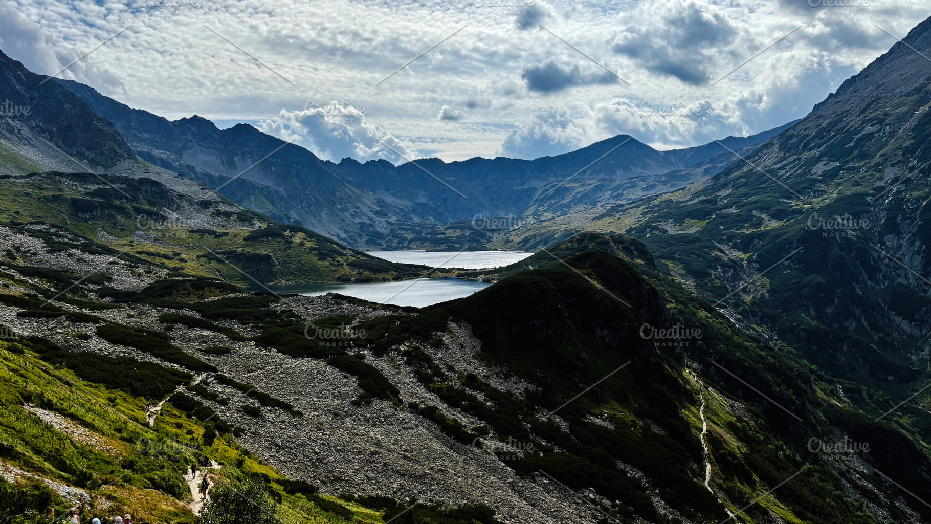 Scenic mountain valley near Zakopane Poland with lake, rugged peaks, and green, a Nature Photo by AS photostudio