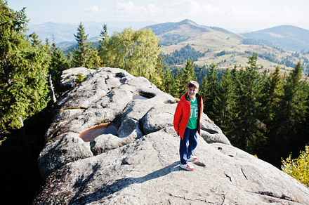 Boy on top of mountain. Children hiking on beautiful day in moun, a Person Photo by AS photostudio