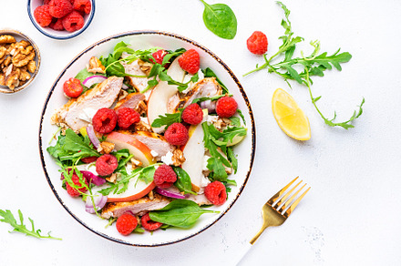 Delicious salad with raspberries, grilled chicken, pears, white, a Food & Drink Photo by 5PH