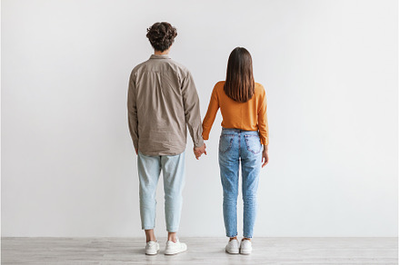 Back view of young Asian couple in, a Person Photo by Prostock-Studio
