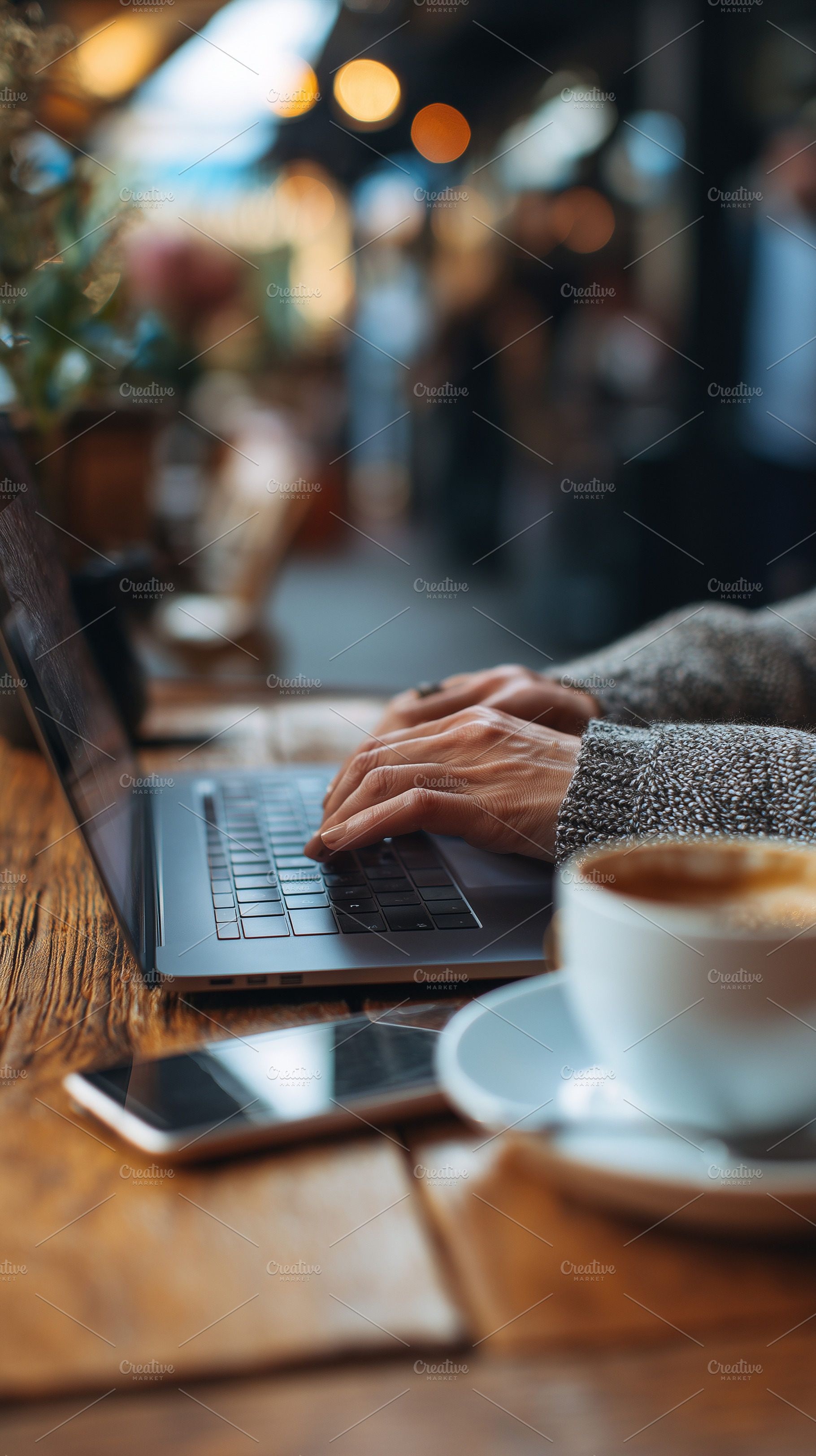 Woman working on laptop in cafe, a Business Photo by MistyDay