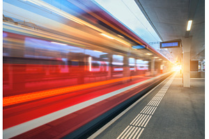 Blurred red passenger train passing, a Transportation Photo by den-belitsky