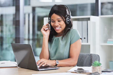 Consulting, laptop and microphone with business woman in office for video conference, webinar and online meeting. Virtual, call center and coaching with black woman and headset for digital help desk, a Photo by Peopleimages.com