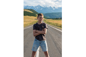 Smiling teen boy on the road in, a Person Photo by Jan Jack Russo Media